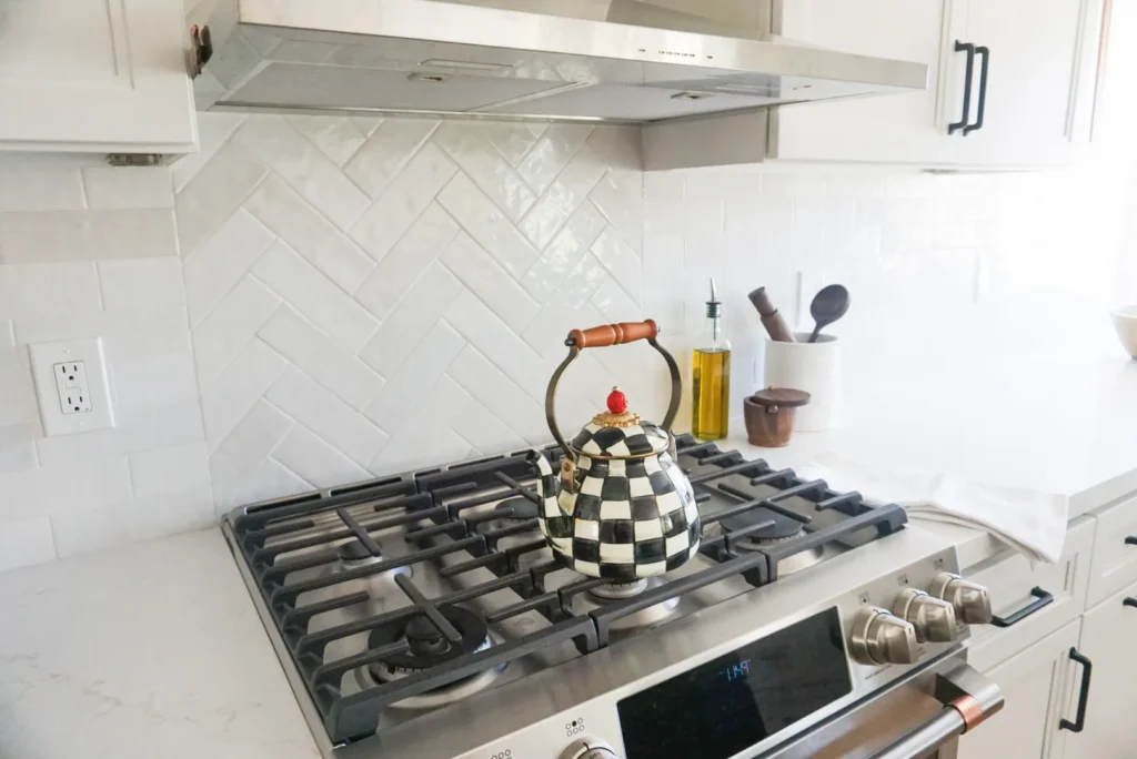 Range and herringbone tile backsplash, Alessandro Heights remodel