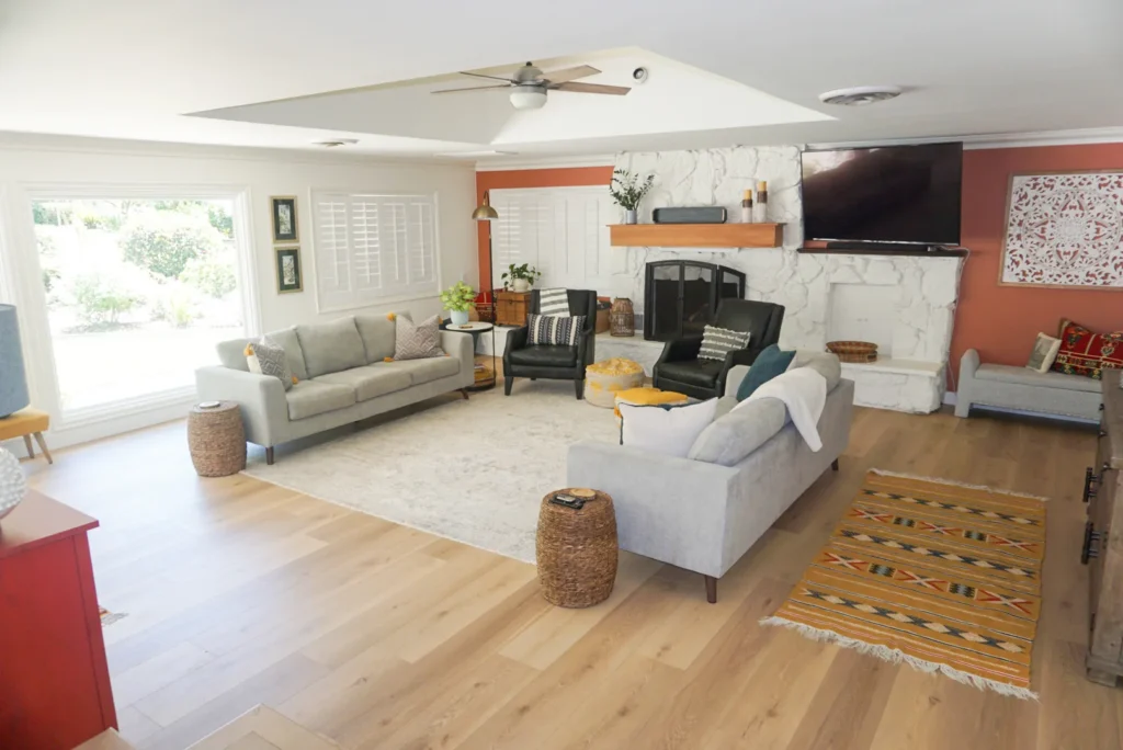 Living room with fireplace wall and wood floors, Alessandro Heights remodel