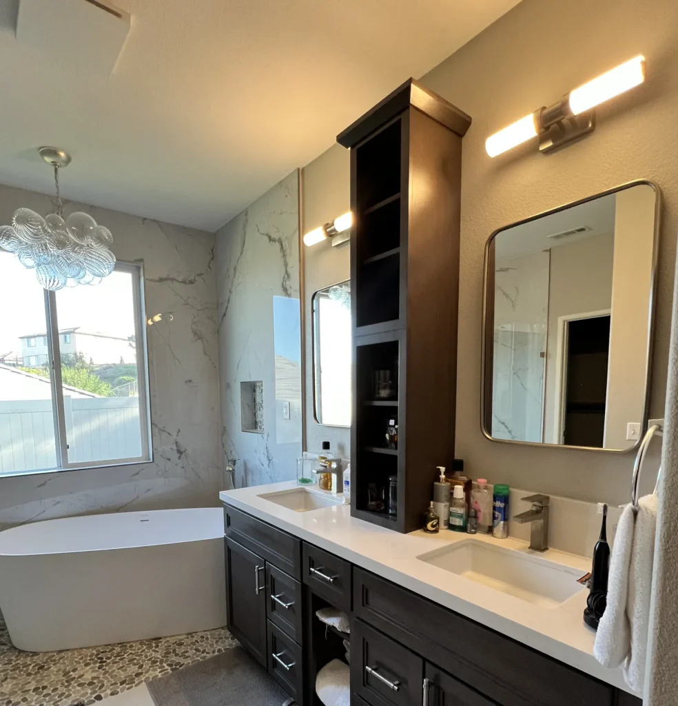 Double vanity with a tall storage tower beside a freestanding tub, Corona Hills