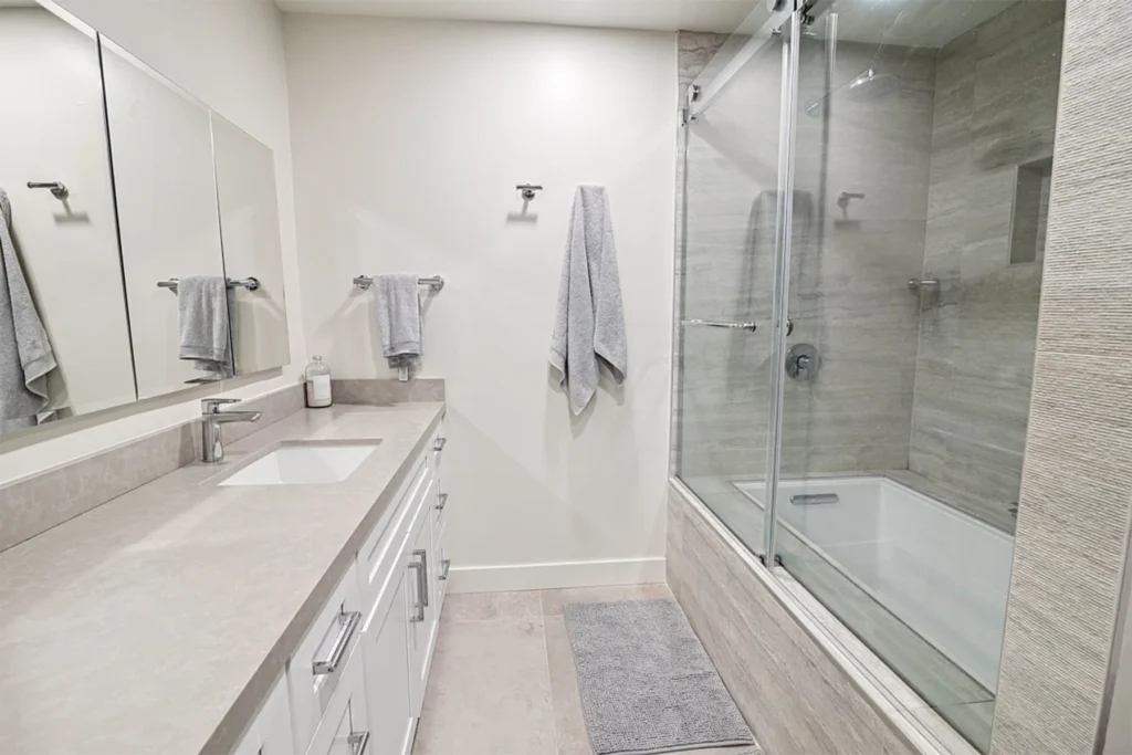 Bathroom with tiled shower and glass door, La Jolla remodel