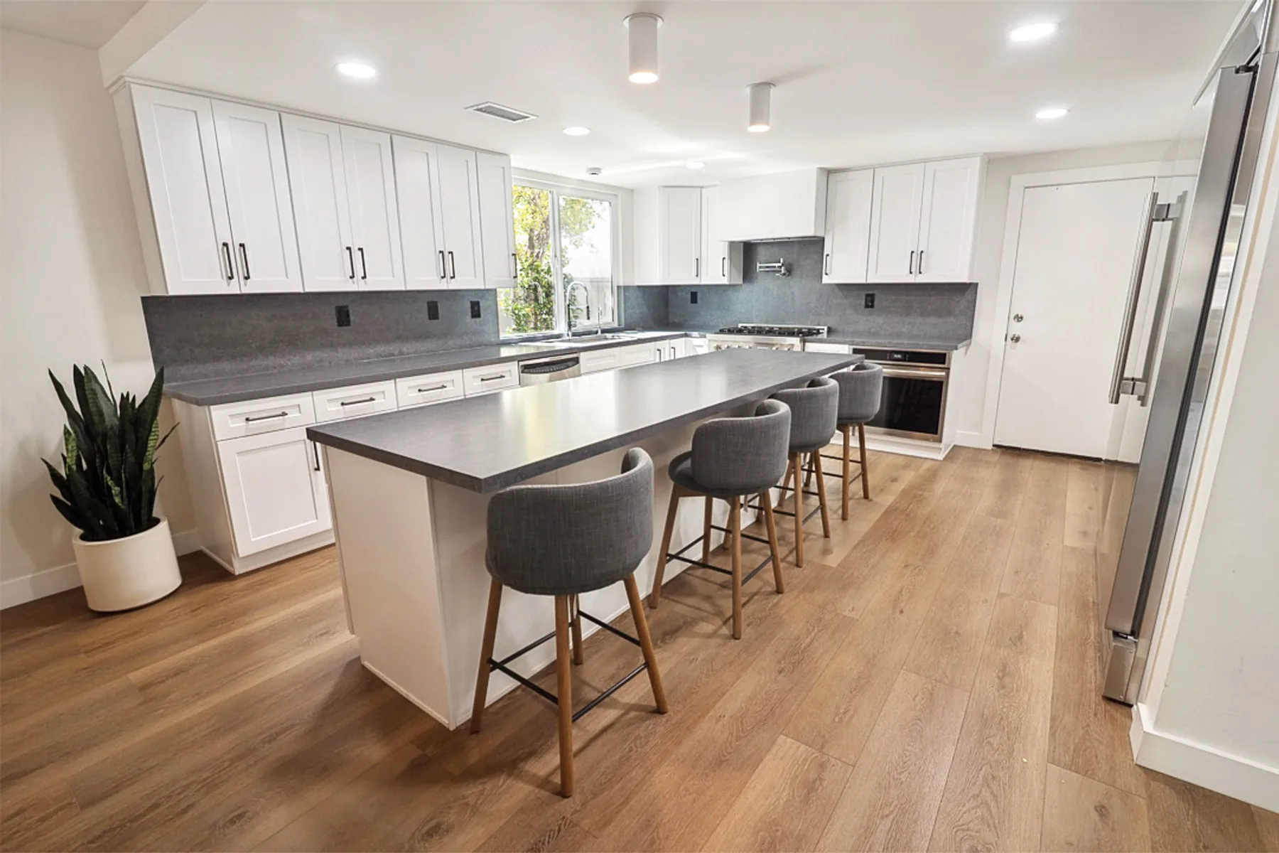 Kitchen island and dark stone counters, La Jolla remodel