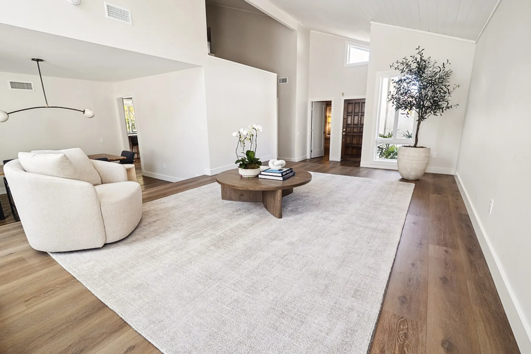 Sitting area with round coffee table, La Jolla remodel