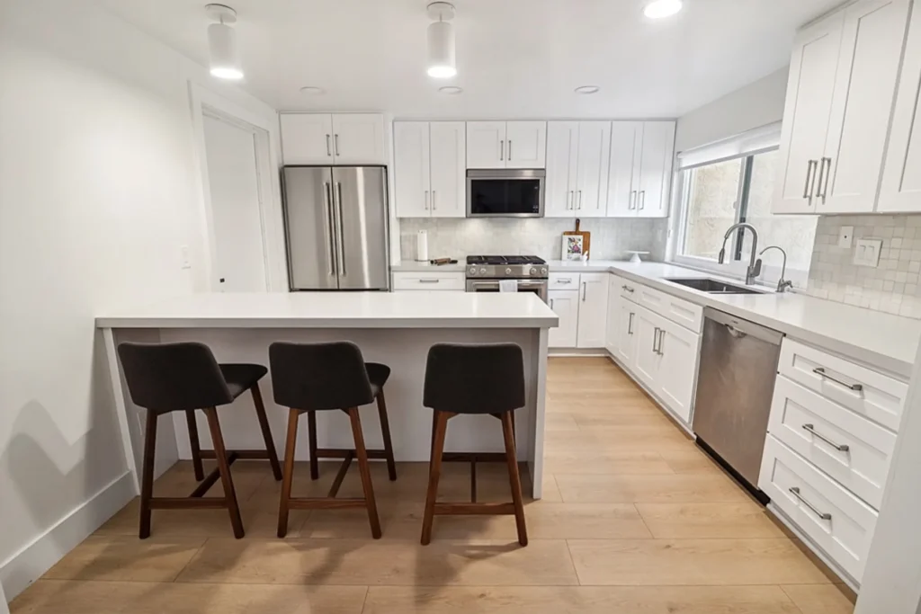 White kitchen with peninsula seating, San Diego remodel