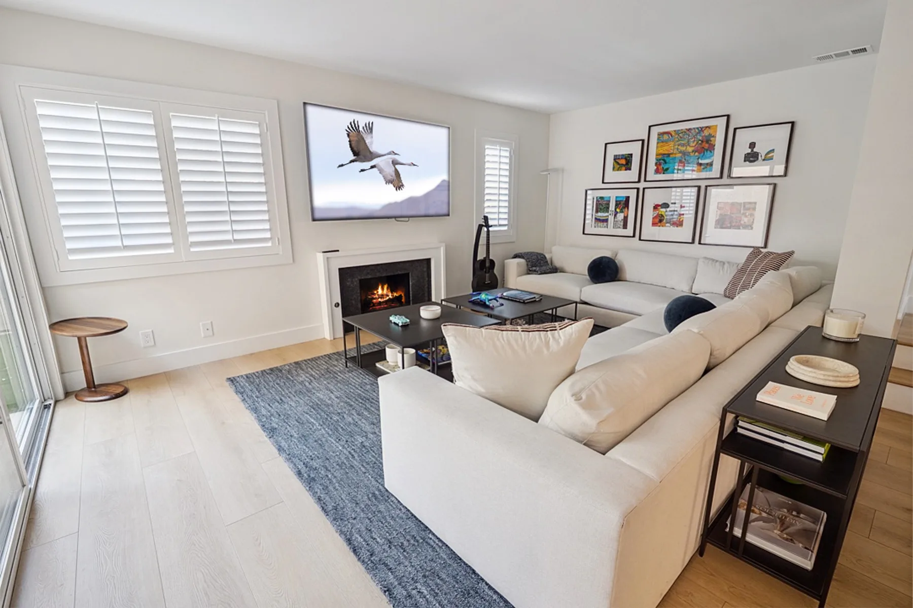 Living room with fireplace and gallery wall, San Diego remodel
