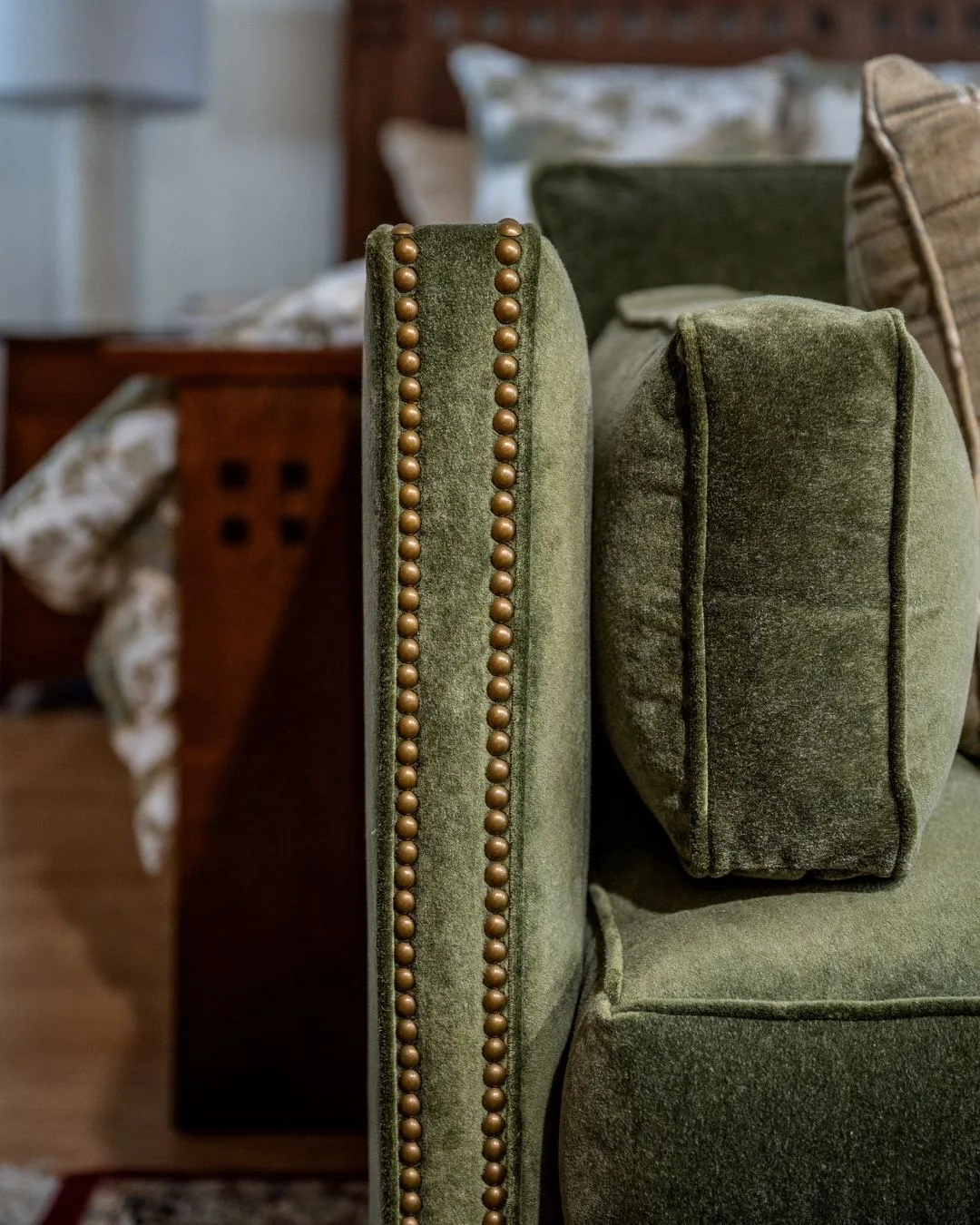 Custom green velvet sofa with nailhead trim