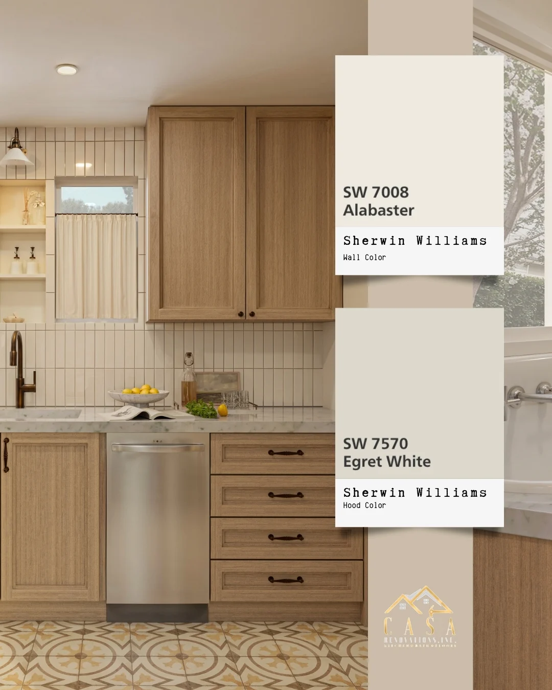 Paint samples held against cabinetry and countertop